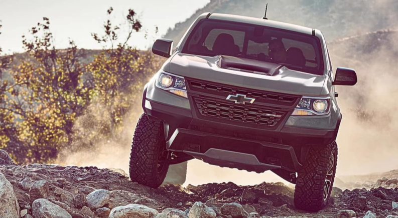 A used grey 2020 Chevy Colorado ZR2 is off roading after leaving a used truck dealership.