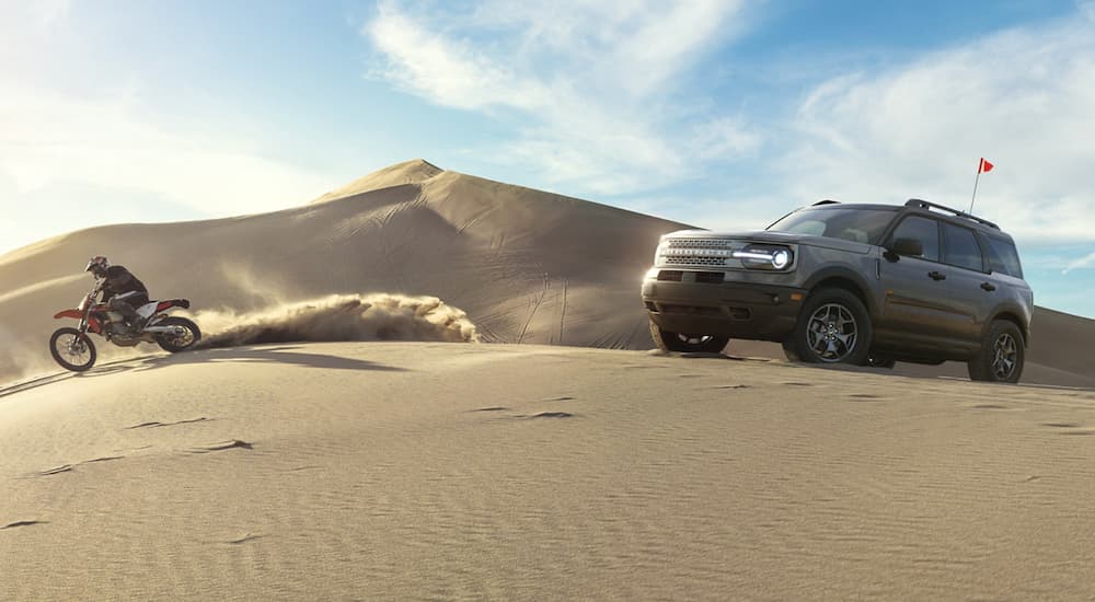 A grey 2021 Ford Bronco Sport is off-roading in the desert after winning a 2021 Ford Bronco Sport vs 2021 Subaru Crosstrek comparison.