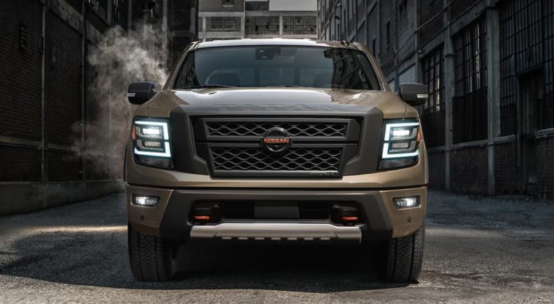 A tan 2021 Nissan Titan is shown from the front after winning a 2021 Nissan Titan vs 2021 Toyota Tundra comparison.