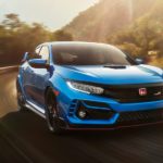 A predecessor of the 2022 Honda Civic Hatchback, a blue 2021 Honda Civic Type R, is shown driving around a corner.