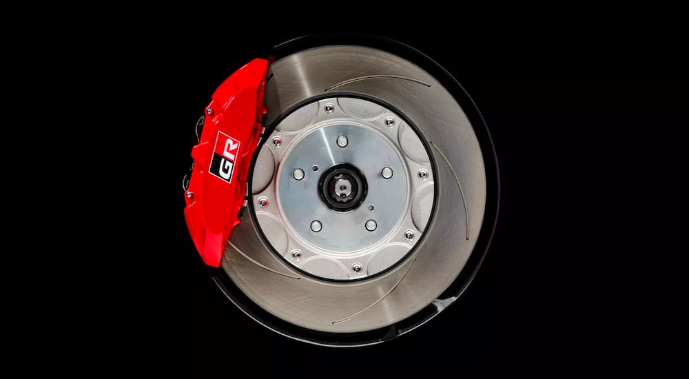 The Gazoo Racing logo is shown on a red caliper over a slotted rotor.