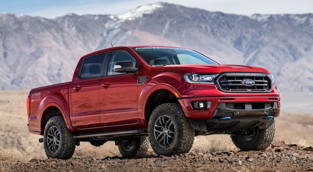 A red 2021 Ford Ranger is shown parked in a desert.
