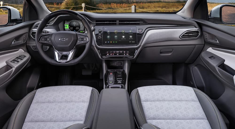 The interior of a 2022 Chevy Bolt EUV shows the steering wheel and infotainment screen.