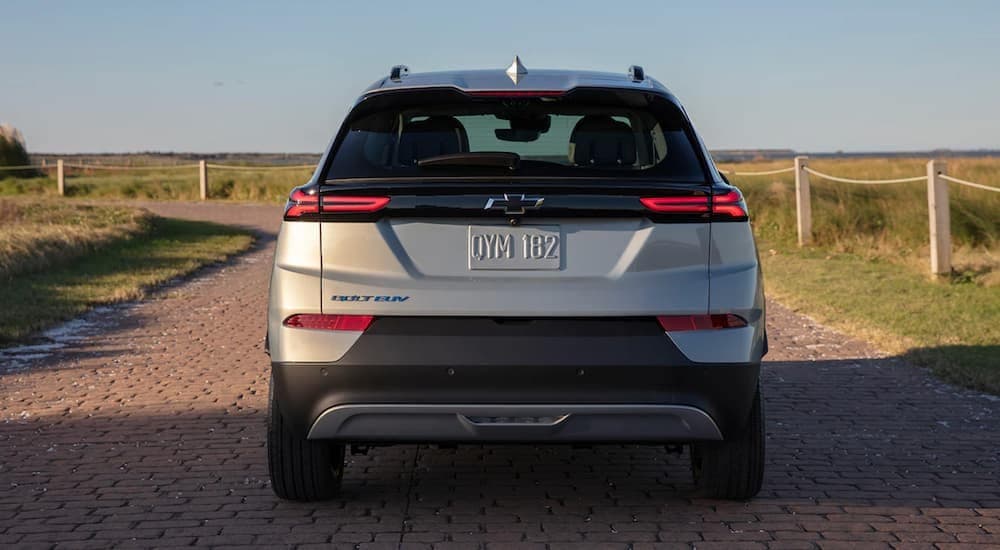 A silver 2022 Chevy Bolt EUV is shown from the rear parked near the ocean.