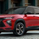 A red 2022 Chevy Trailblazer RS is shown from an angle parked on a city street.