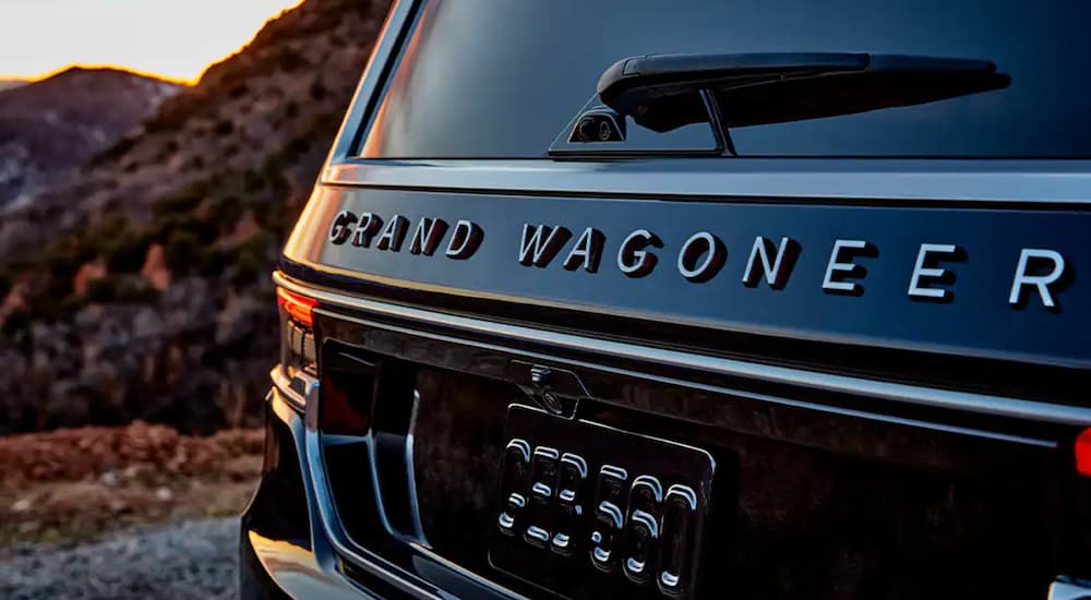 The rear of a black 2022 Grand Wagoneer is shown in close up.