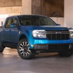 A blue 2022 Ford Maverick Lariat is shown in a concrete space.