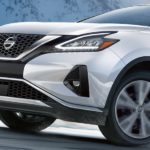 A white 2021 Nissan Murano is shown from the side driving on an open road after winning a 2021 Nissan Murano vs 2021 Chevy Blazer comparison.