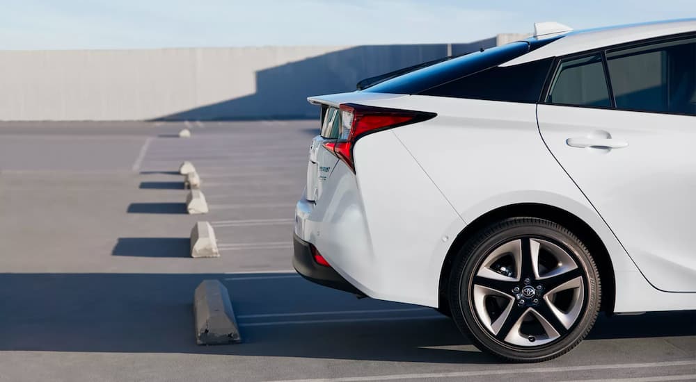 A white 2022 Toyota Prius Limited is shown parked in a lot.
