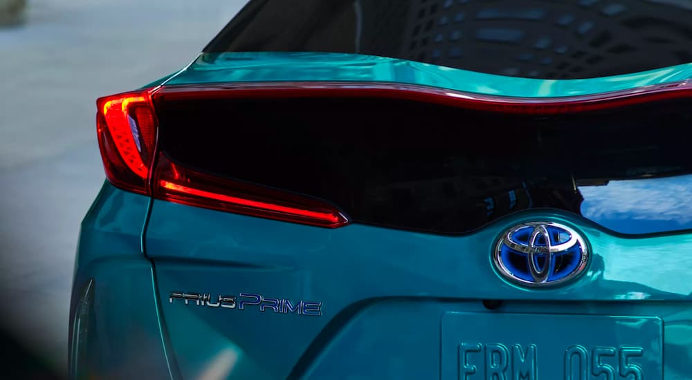 A close up shows the badge on the trunk of a 2022 Toyota Prius Prime Limited.