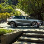 A grey 2023 Cadillac Lyriq is shown from the side in a driveway.