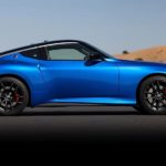 A blue 2023 Nissan Z is shown from the side parked on a desert road after leaving local Nissan dealers.