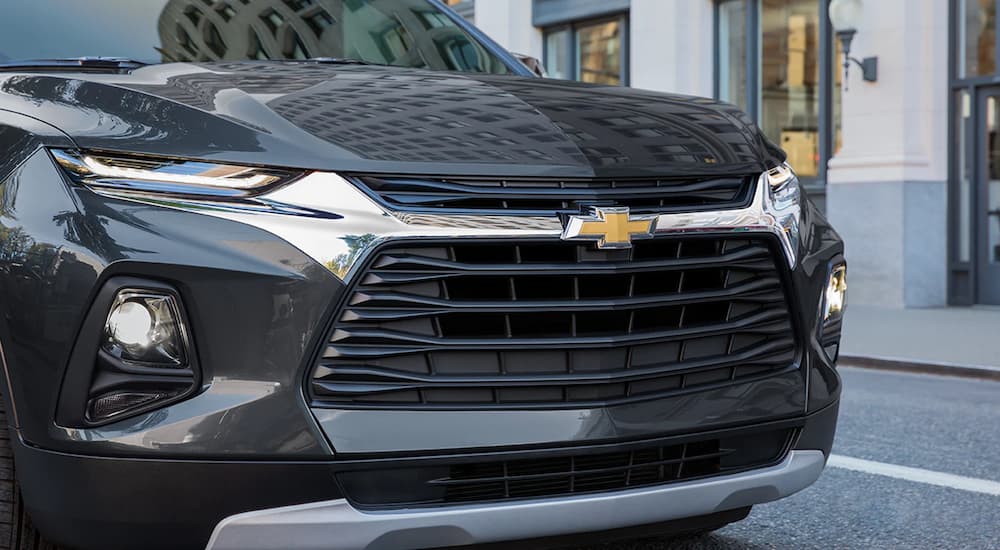 A close up of a black 2022 Chevy Blazer shows the grille and headlights.