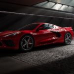 A red 2022 Chevy Corvette Stingray is shown parked in a dark tunnel.