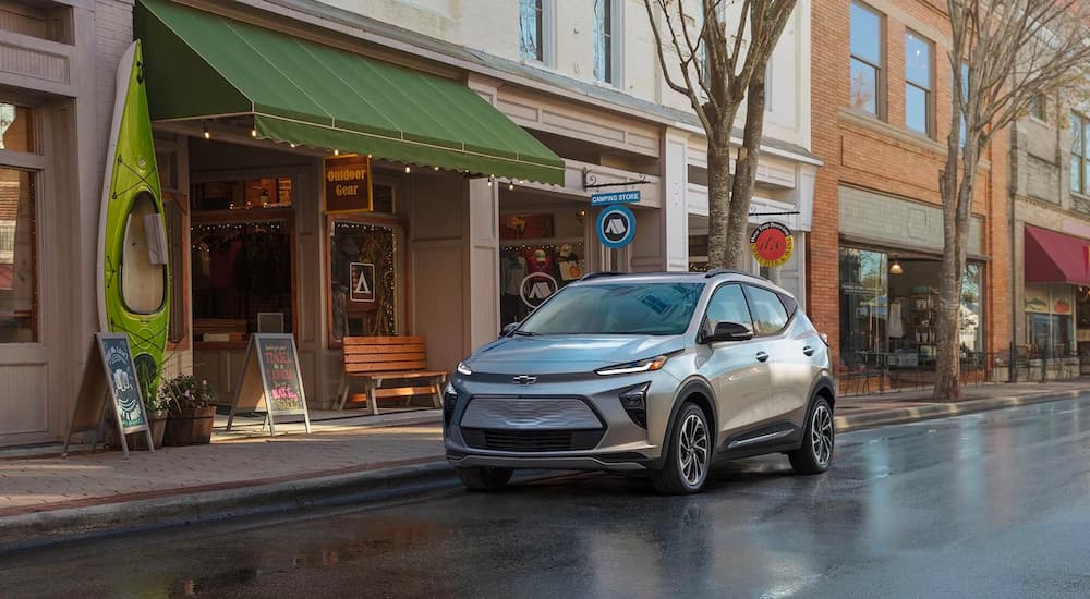 A silver 2022 Chevy Bolt EUV is shown parked in on the side of a city street.