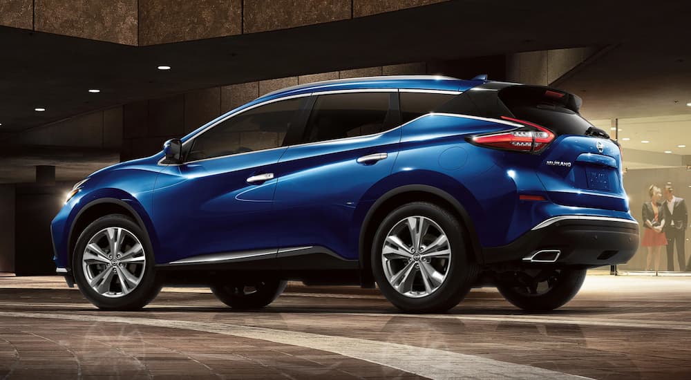 A blue 2021 Nissan Murano is shown from a rear angle during a 2021 Nissan Murano vs 2021 Chevy Blazer style comparison.