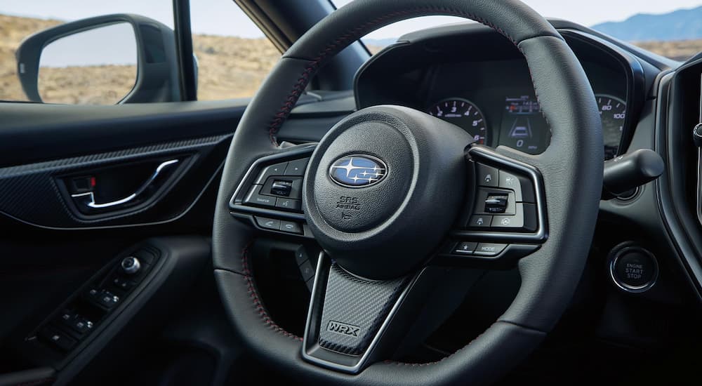 The black interior of a 2022 Subaru WRX is shown at a Subaru WRX dealer.