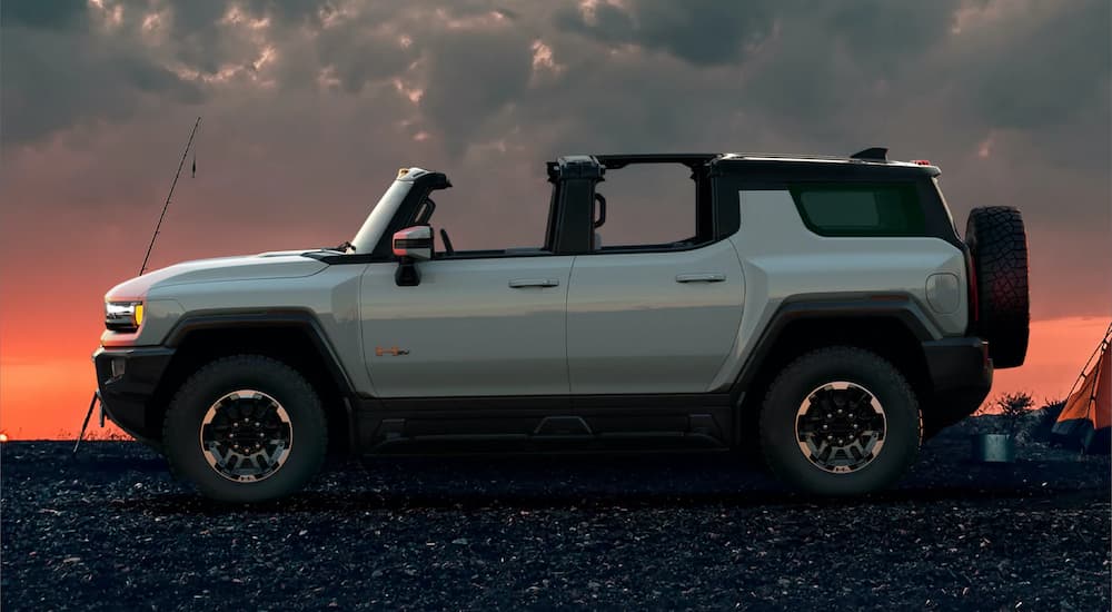 A silver 2022 GMC Hummer EV is shown from the side.