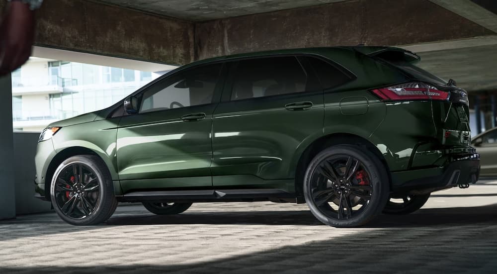 A green 2022 Ford Edge ST is shown from the side parked in a parking garage.