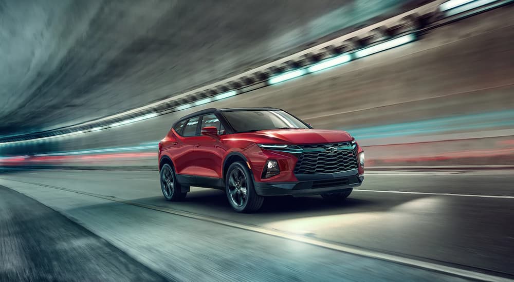 A red 2022 Chevy Blazer RS is shown driving through a tunnel during a 2022 Ford Edge vs 2022 Chevy Blazer comparison.