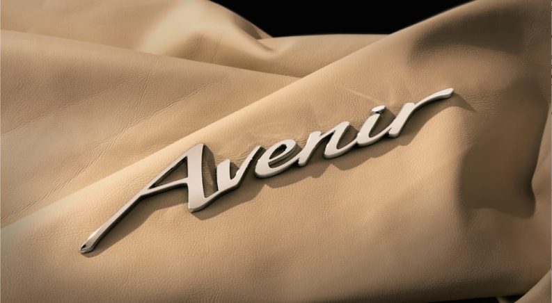A close up shows the Avenir badge on leather.