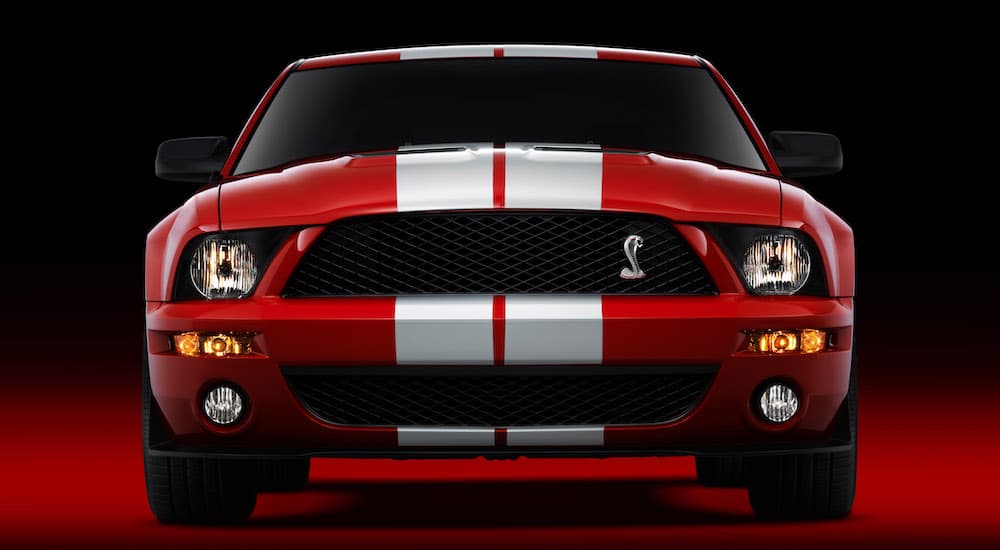 A red and white 2007 Ford Mustang is shown from the front.