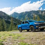 A blue 2022 Chevy Colorado Z71 Trail Boss is shown parked in the mountains.