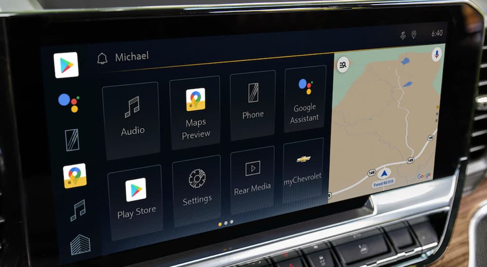 The black interior of a 2022 Chevy Silverado 1500 ZR2 shows the infotainment screen.