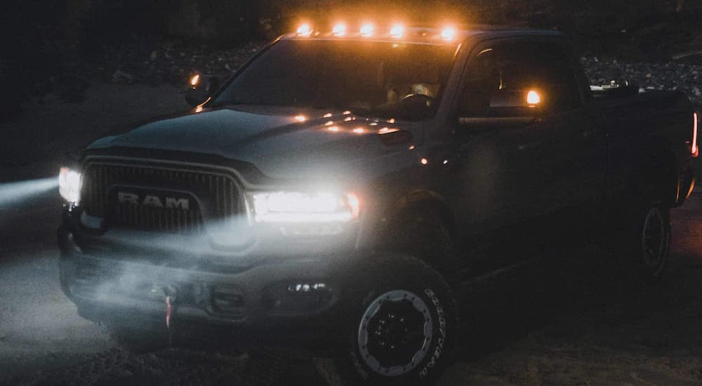A blue 2022 Ram 2500 Power Wagon is shown towing in the dark.