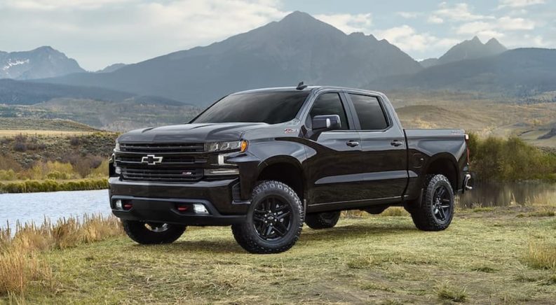 A black 2022 Chevy Silverado 1500 Limited Z71 is shown parked near a body of water.