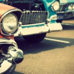 A parking lot is filled with vintage cars after someone searched "sell my car."