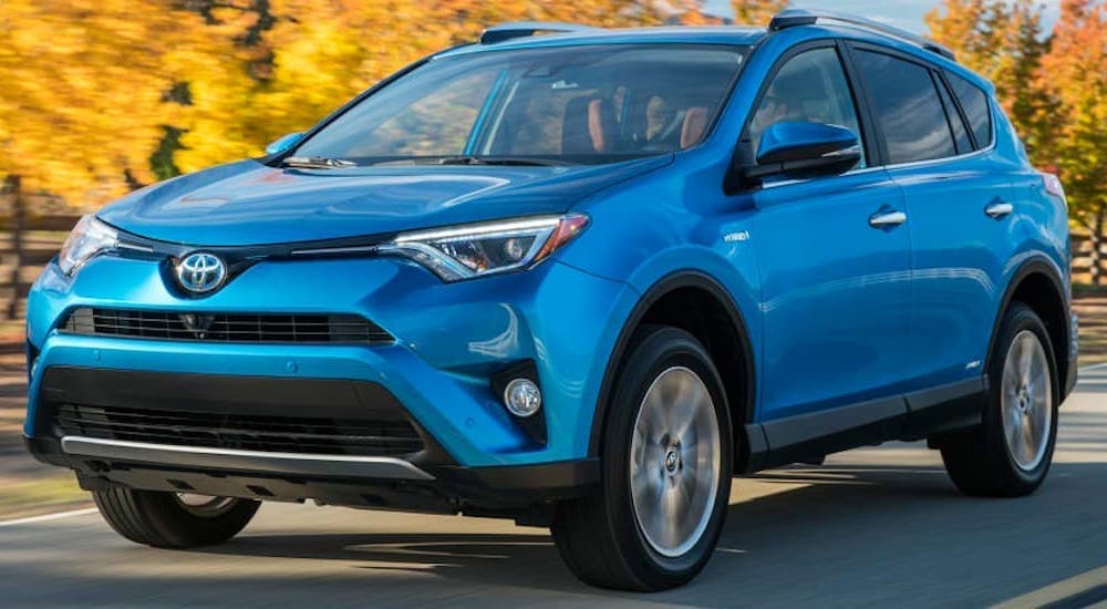 A blue 2016 Toyota RAV4 is shown from the front at an angle.