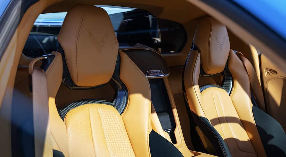 The black and yellow interior of a 2022 Chevy Corvette shows the front seats.