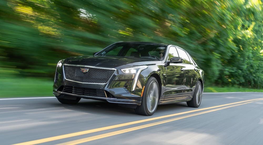 A grey 2019 Cadillac CT6-V is shown from the front at an angle while it drives down the road.