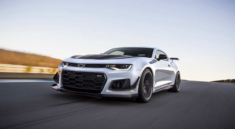 A white 2021 Chevy Camaro ZL1 1LE is shown from the front at an angle.