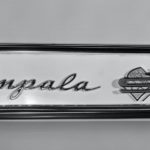 The 1961 Chevy Impala SS badge is shown in close up.