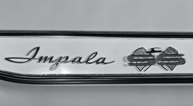 The 1961 Chevy Impala SS badge is shown in close up.