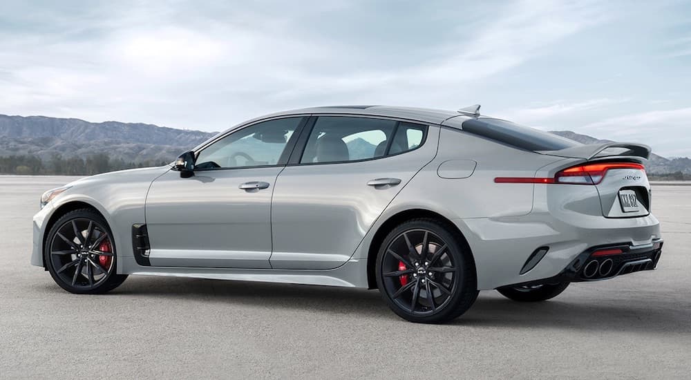 A grey 2022 Kia Stinger GT is shown from the side at an angle.