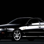 A black 1998 Nissan Skyline Turbo is shown on a black background.
