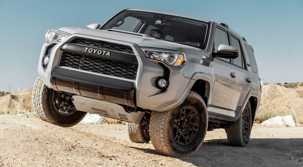 A grey 2022 Toyota 4Runner is shown from the front at an angle while off-road during a 2022 Jeep Grand Cherokee WL vs 2022 Toyota 4Runner comparison.