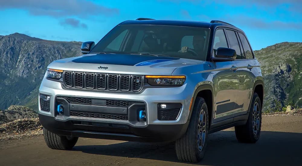 A silver 2022 Jeep Grand Cherokee is shown from the front at an angle.