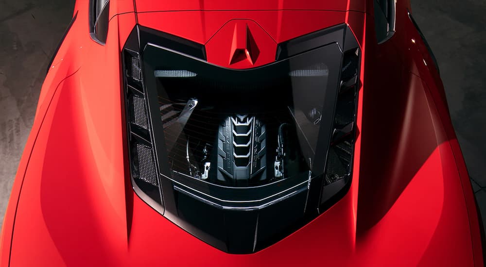 A top view of a red 2023 Corvette Stingray shows the engine.