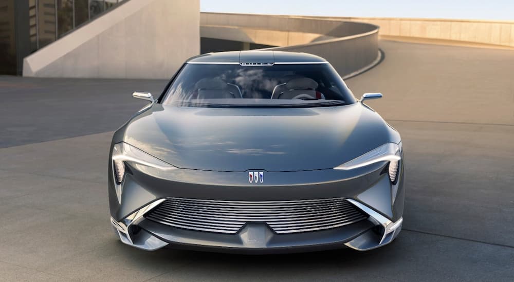 A silver Buick Wildcat EV Concept is shown from the front at a parking garage.