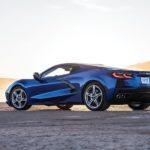 A blue 2023 Chevy Corvette is shown from the side after leaving a Chevy dealer.