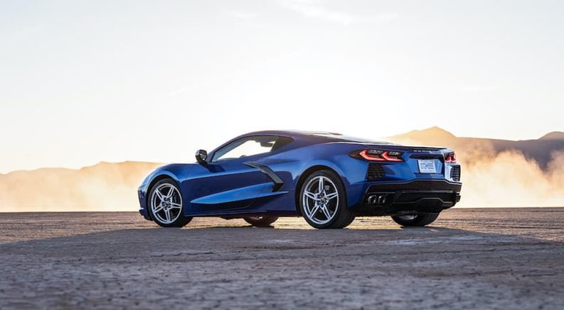 A blue 2023 Chevy Corvette is shown from the side after leaving a Chevy dealer.