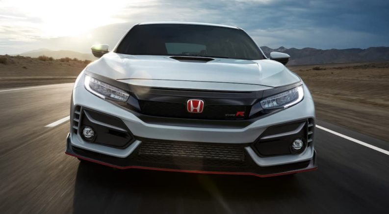 A white 2021 Honda Civic Type R is shown from the front after leaving a Honda dealer.