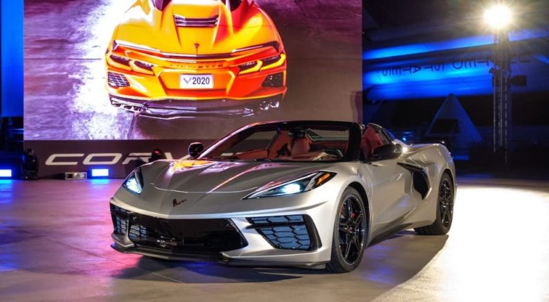 A silver 2020 Chevy Corvette is shown from the front at an angle.
