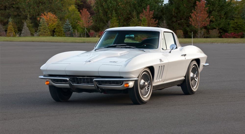 A white 1966 Chevy Corvette is shown from the front at an angle after leaving a used Chevy dealer.