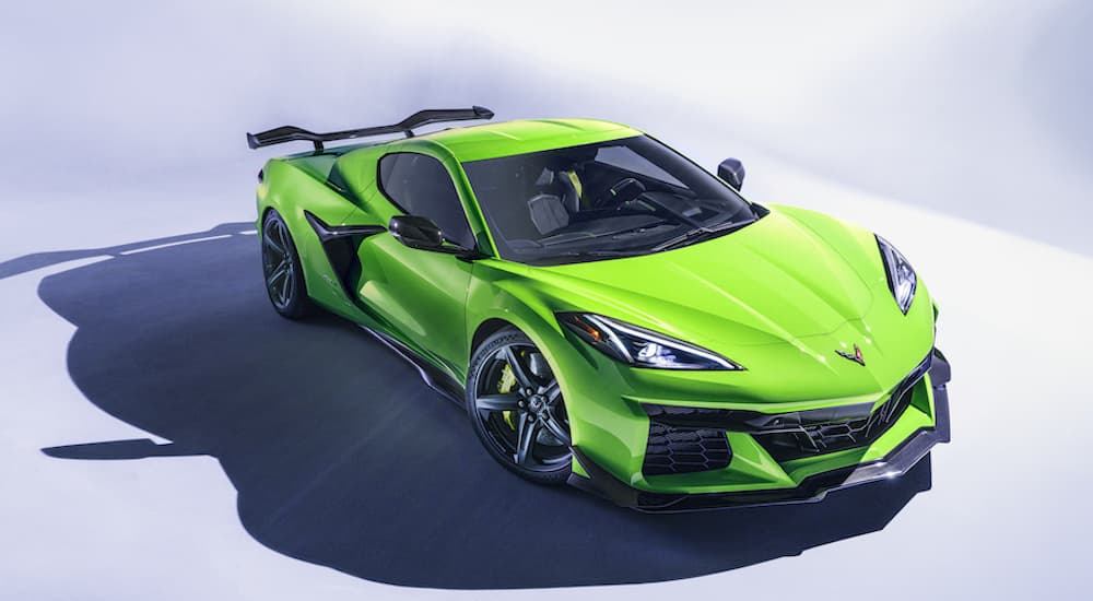 A green 2023 Corvette Z06 is shown from the front at an angle.