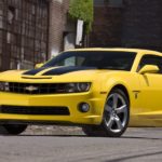 A yellow 2010 Chevy Camaro SS Transformers Edition is shown from the front at an angle.